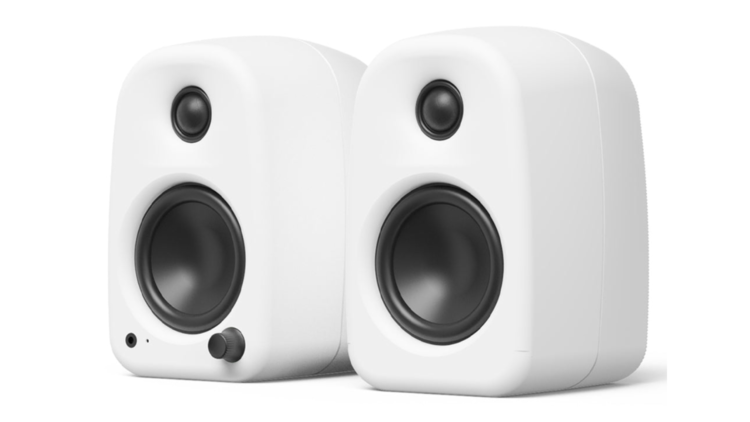 A left-angled view of chalk UKI desktop speakers
