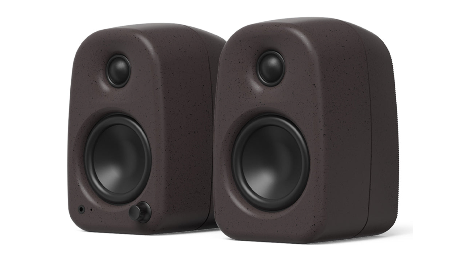 A left-angled view of pumice UKI desktop speakers