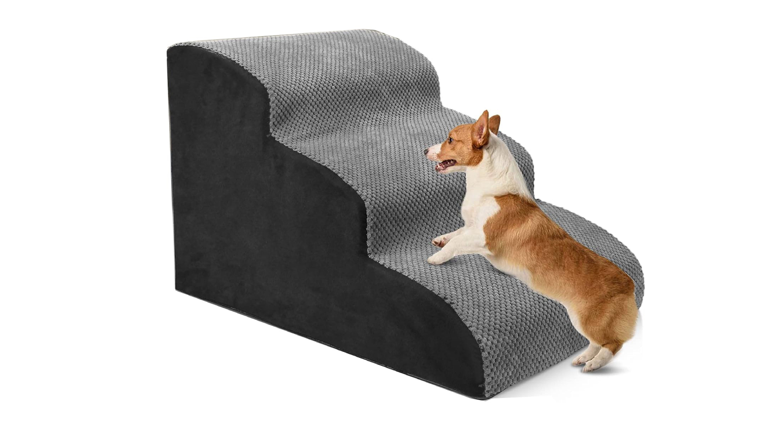 A right-angled view of a foam pet stairs with a dog climbing on it