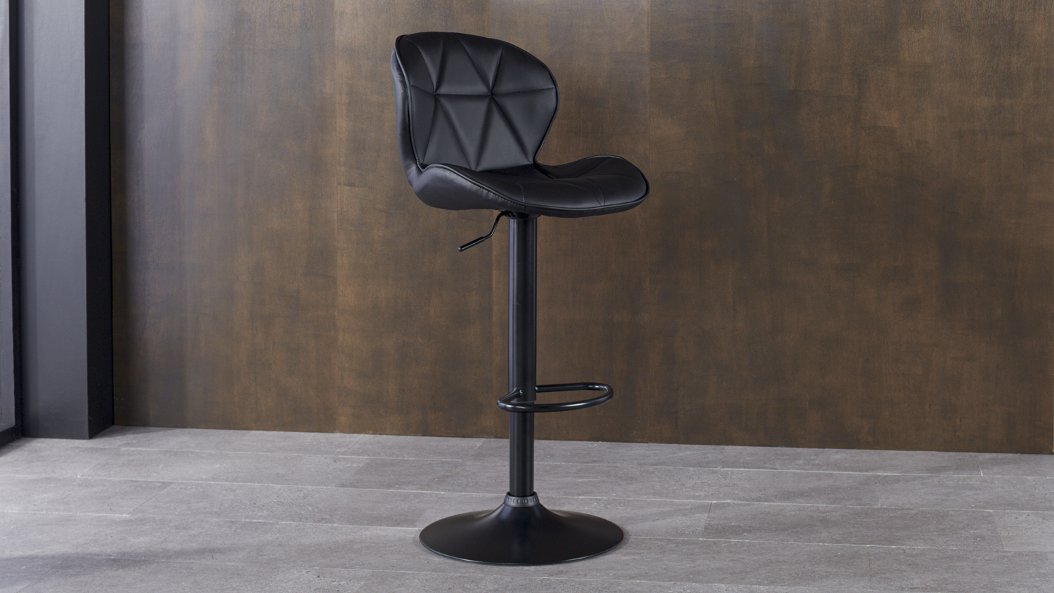 Mondo Bar Stool with a black PU leather seat featuring geometric stitching and a curved backrest