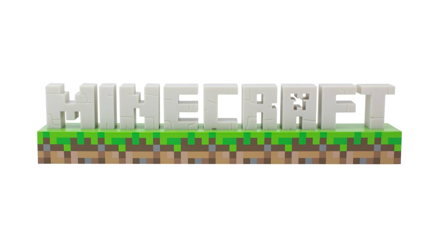 White 3D “Minecraft” logo LED light on a rectangular base designed like grass blocks from the game