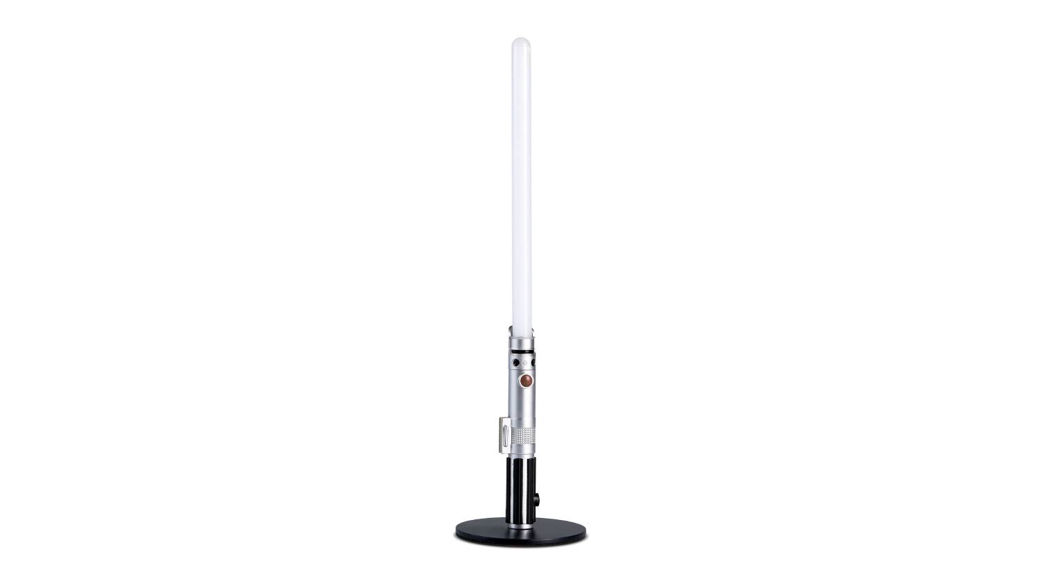 Luke Skywalker lightsaber-themed LED desk lamp with a silver and black hilt mounted on a round black base