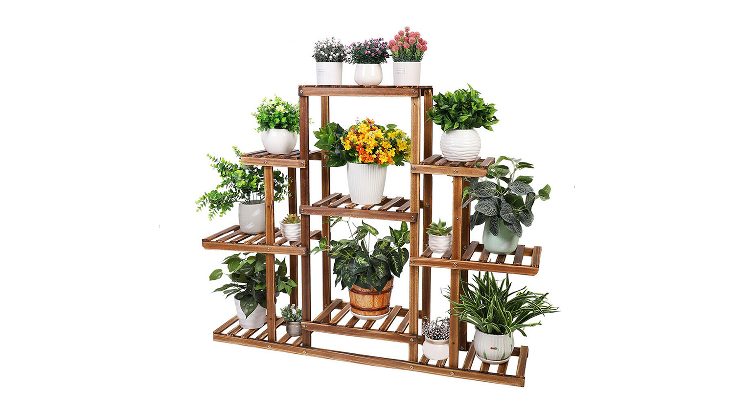 A large, tiered wooden flower stand is filled with various potted green plants and colourful flowers