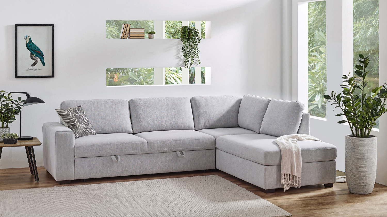 Connor 3-seater light gray fabric corner sofa bed with chaise in a modern living room setting