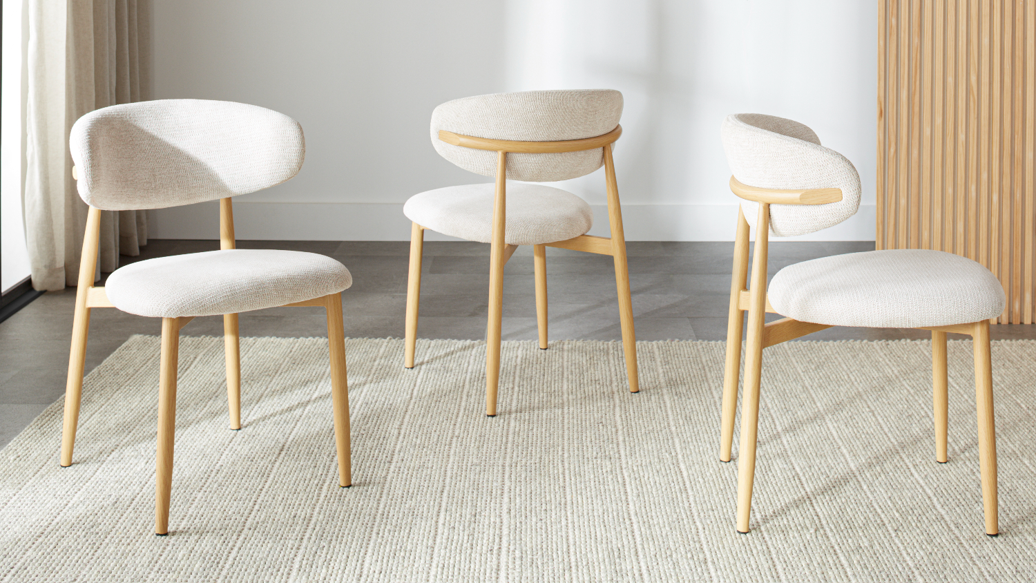 Three modern Ryder dining chairs with sleek frames and upholstered seats