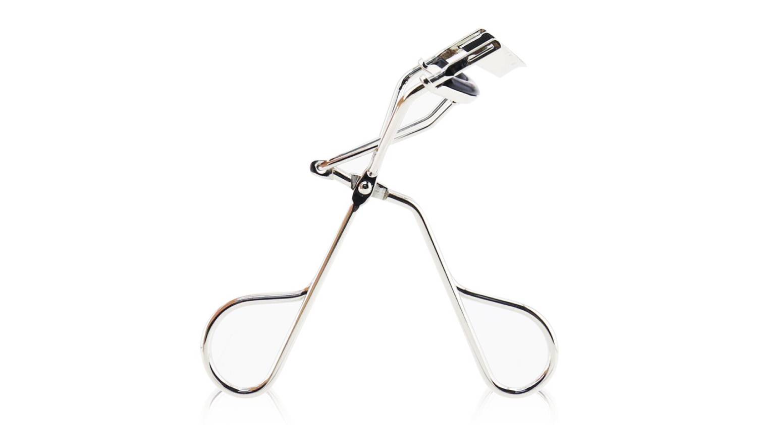 A close-up image of the Shu Uemura eyelash curler shown standing upright