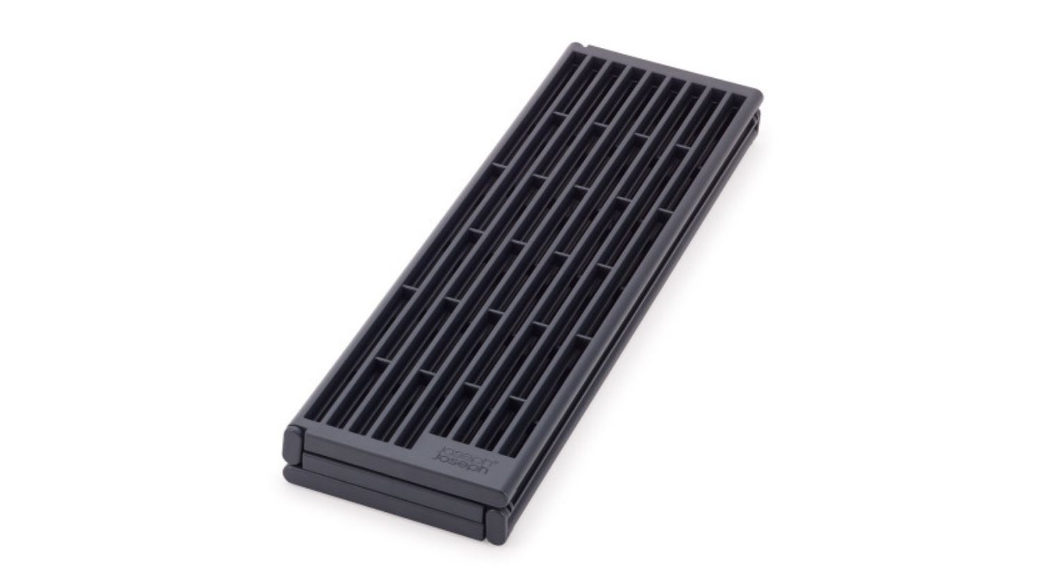 Folded Joseph Joseph over-sink platform in dark grey with gridded design for drainage and compact storage