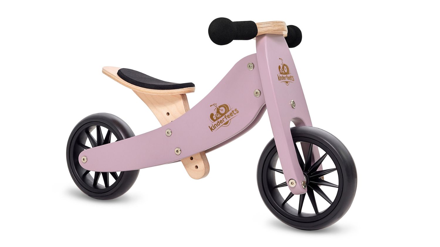 Lavender Kinderfeets Tiny Tot wooden balance bike with black wheels and padded seat