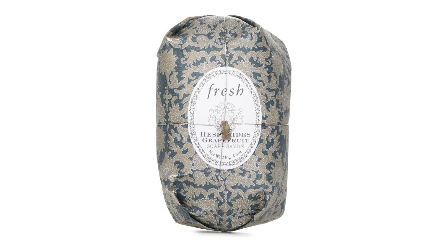Fresh Original Soap in Hesperides Grapefruit scent, wrapped in elegant dark blue paper with beige floral pattern