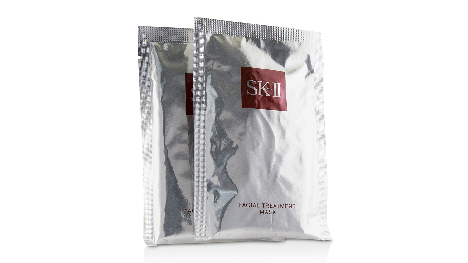 Two silver SK-II Facial Treatment Mask sachets standing upright