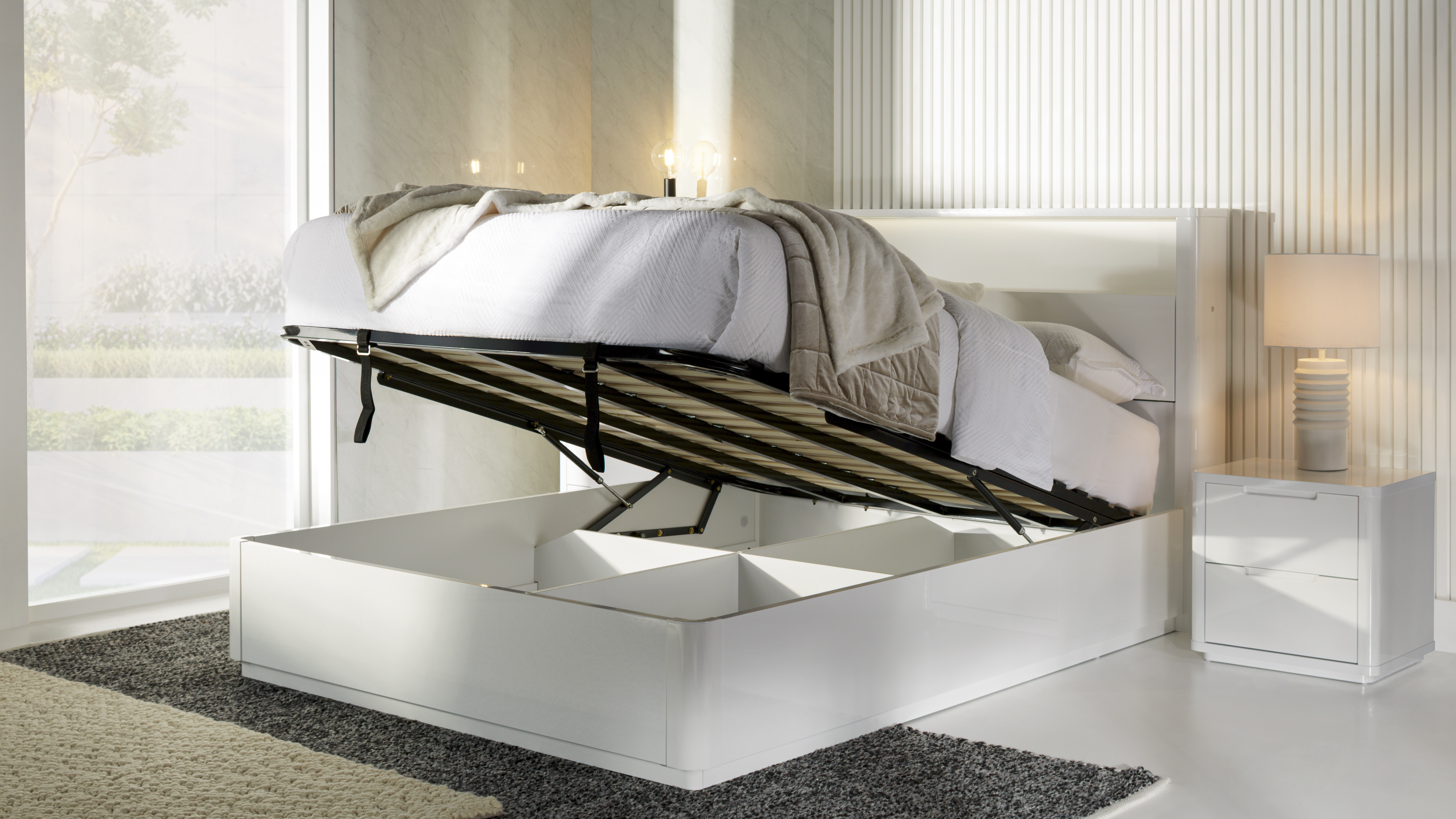 Adanya Queen Bed with mattress raised via gas lift to reveal large under-bed storage compartments
