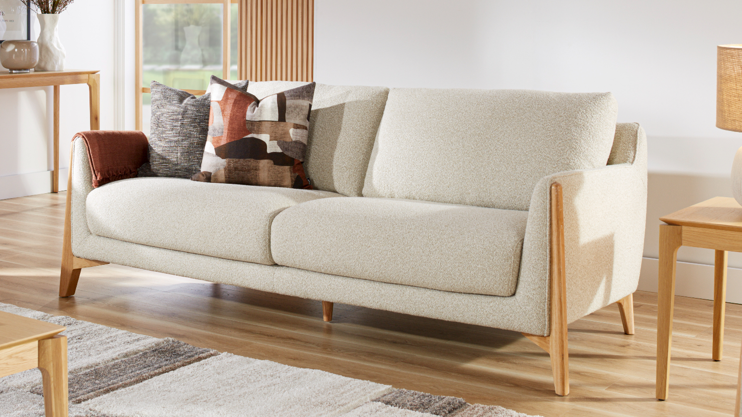 Front view of a Gandolfi 3 seater fabric sofa featuring a modern design and timber frame