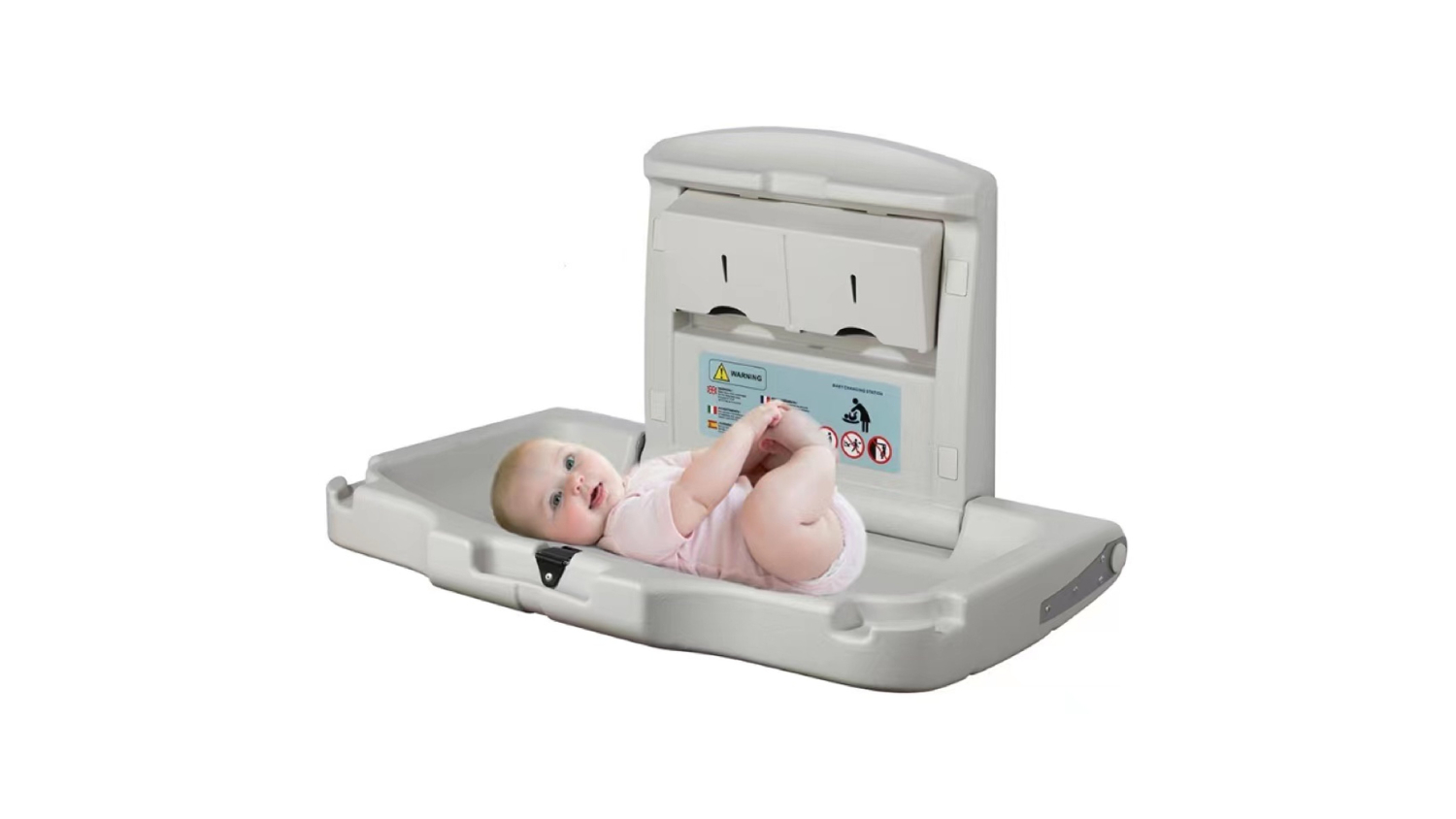 A baby lying on a MyWashroom Sturdy Commercial Baby Change Table with a safety belt and visible instruction labels