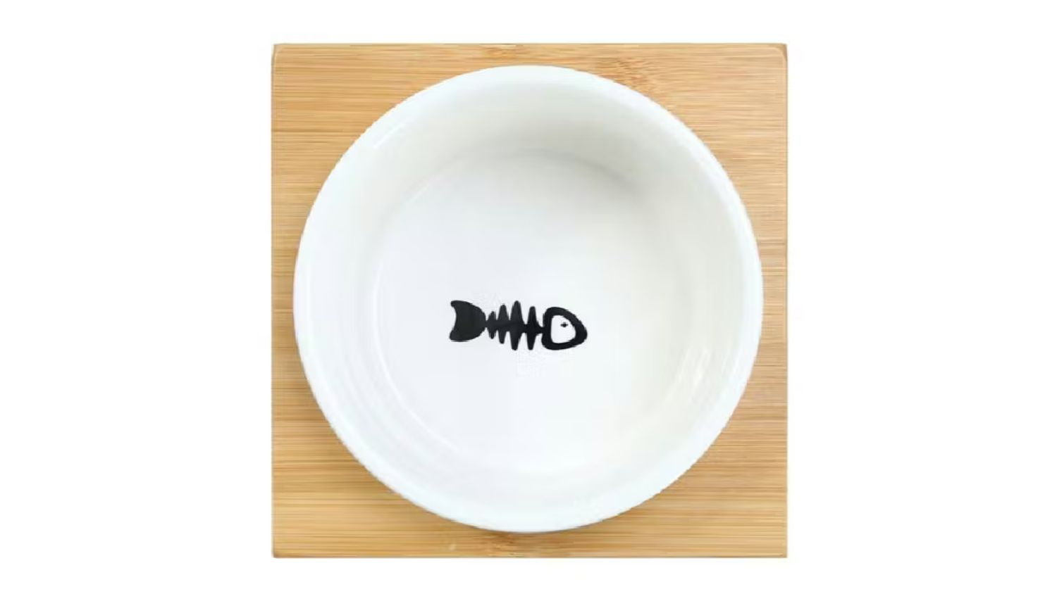 Top view of the Ceramic Pet Cat Bowl on a wooden stand with a black fishbone design in the centre