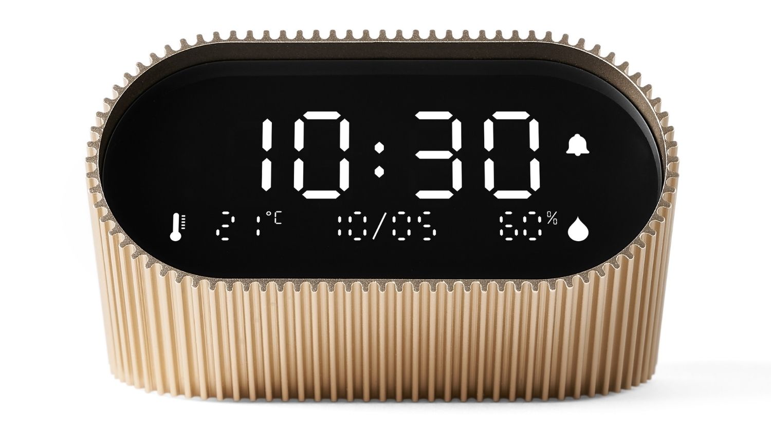 A front view of a gold ribbed digital alarm clock featuring a clear LED display showing the time on a smooth white background