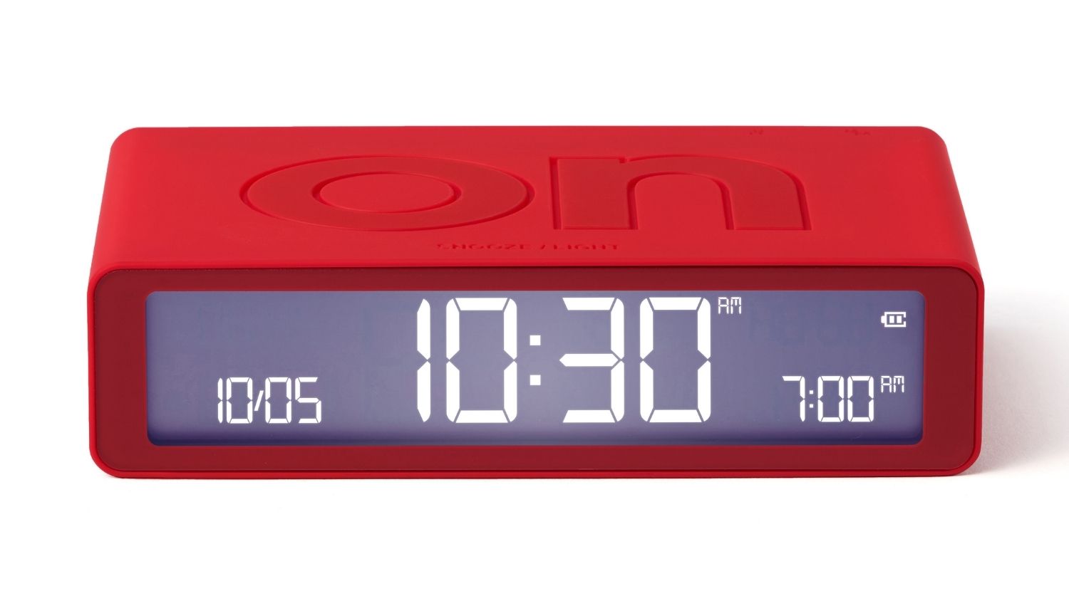 A front view of a red digital alarm clock showing the time, with the word “off” embossed on the top panel