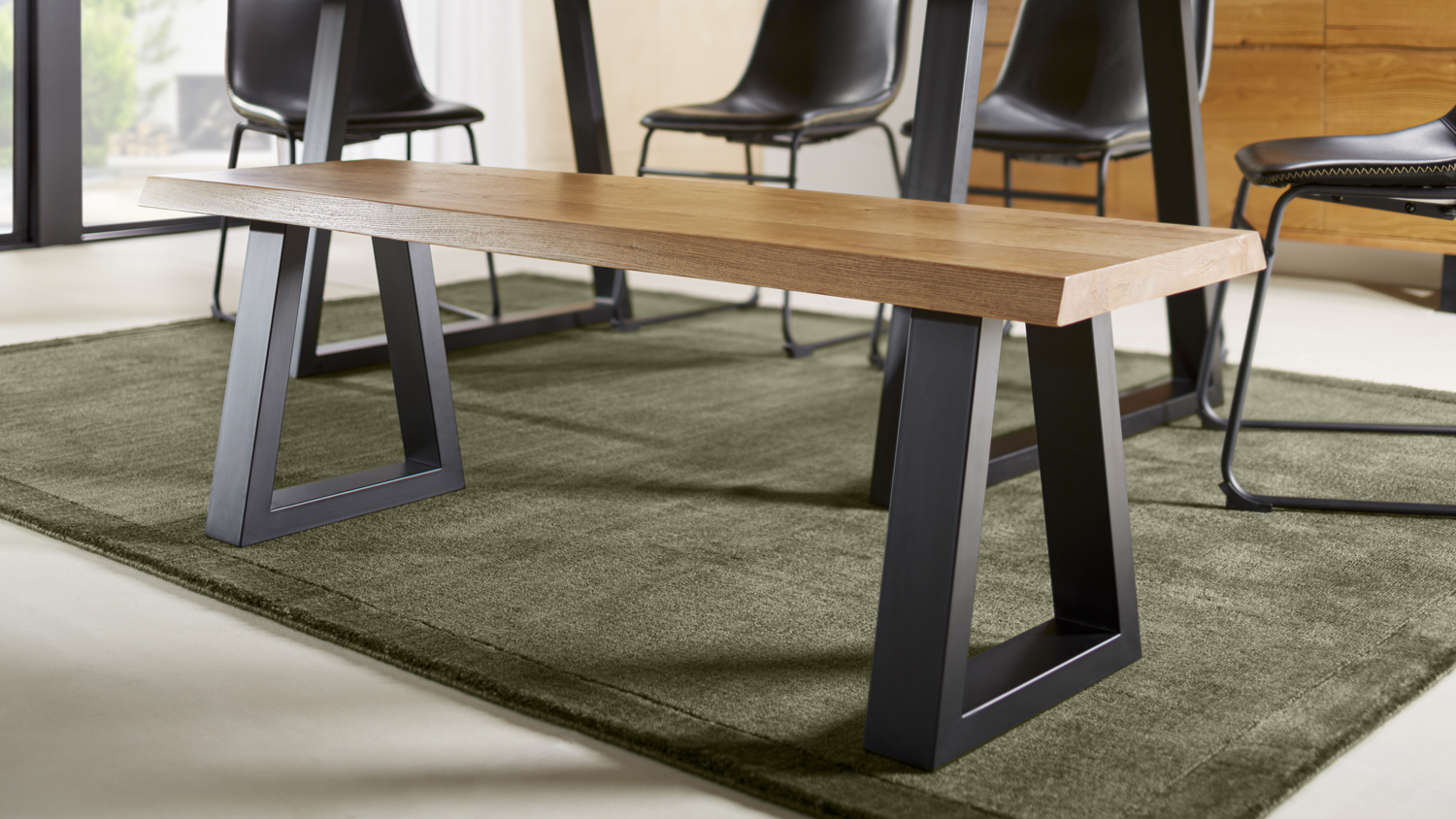 Modern industrial Kubu dining bench featuring a thick oak-finish seat and sturdy black metal frame