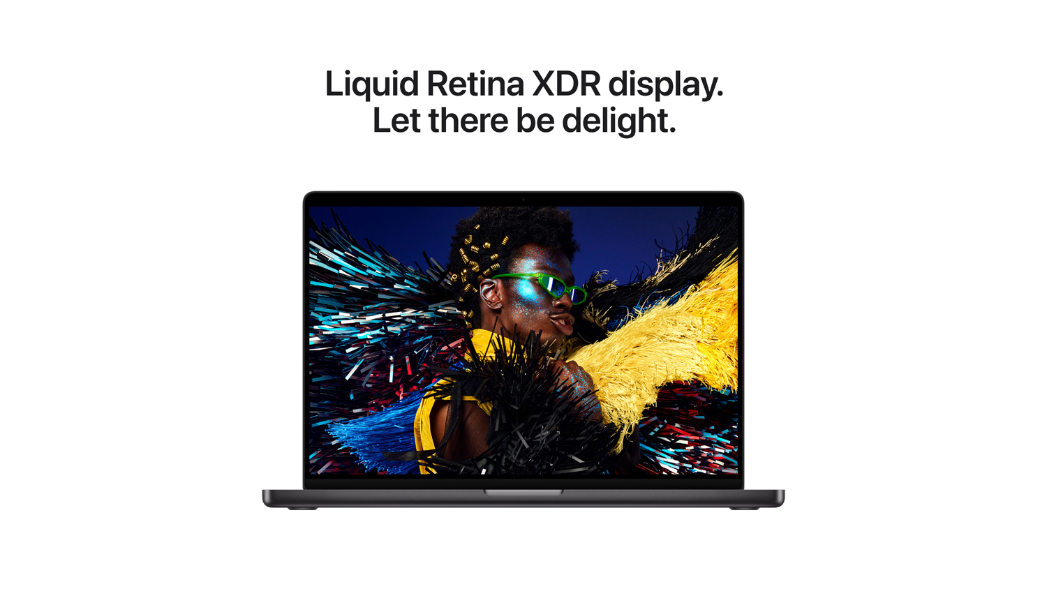 Black MacBook Pro displaying a vibrant, colourful portrait on a Liquid Retina screen
