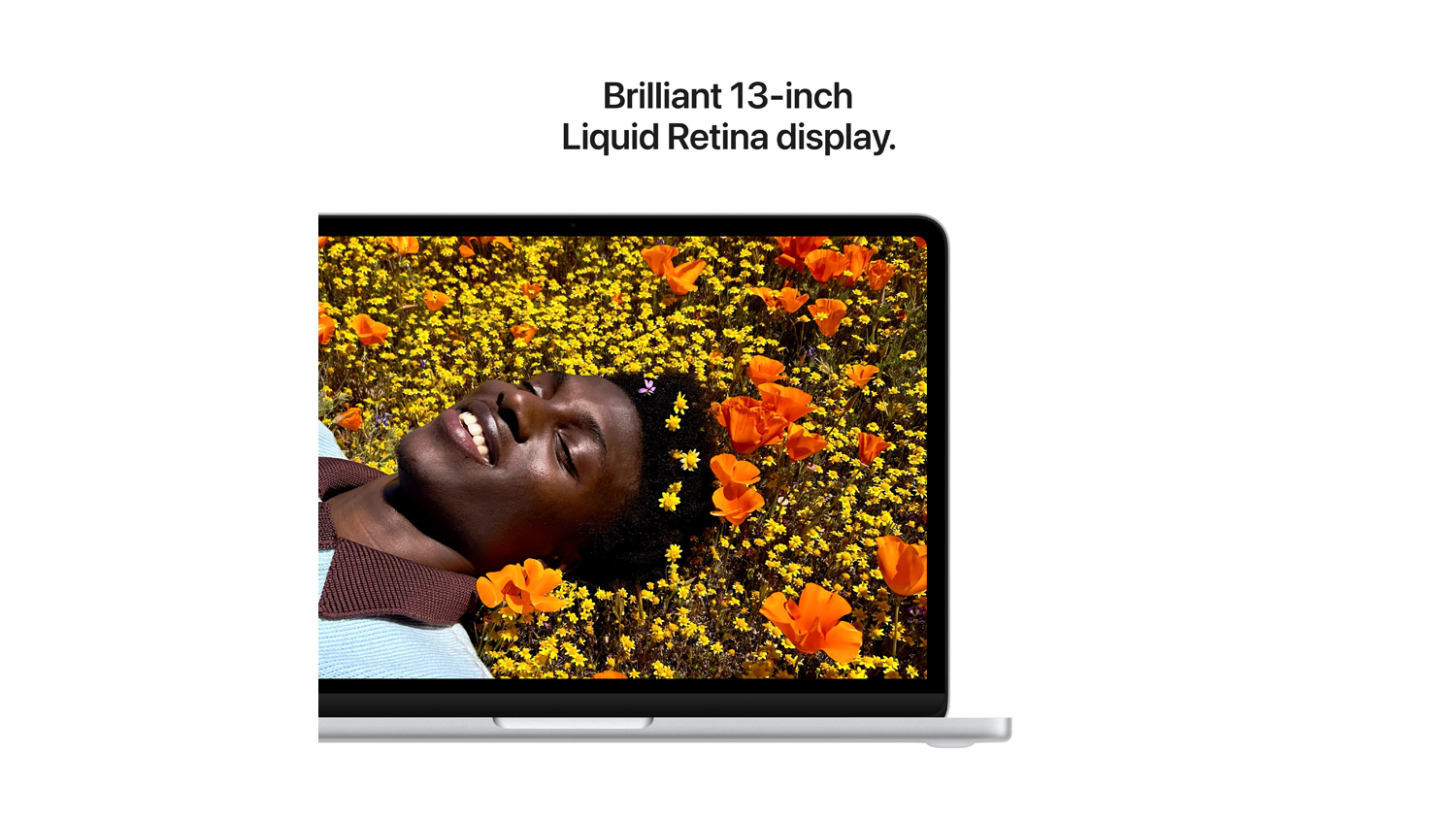 Close-up of the MacBook Neo 13-inch Liquid Retina display showing a vibrant, high-detail floral image