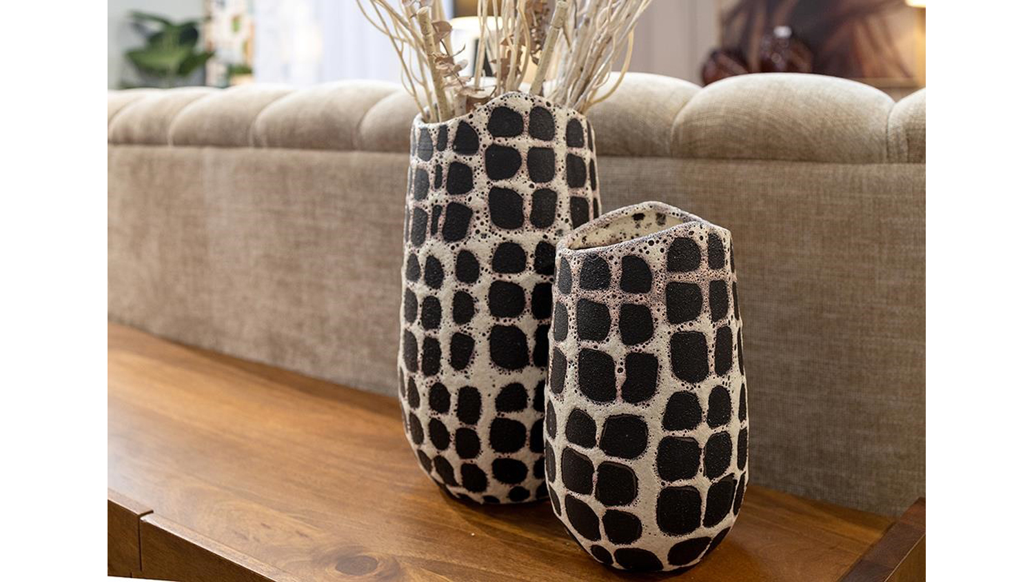 A view of two Odette Ceramic Vases displayed in a living room