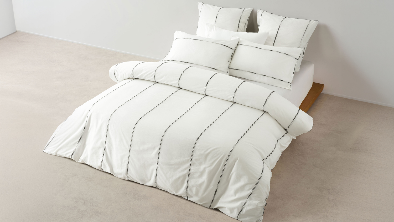 Bed styled with the Jerome duvet cover set featuring crisp white fabric