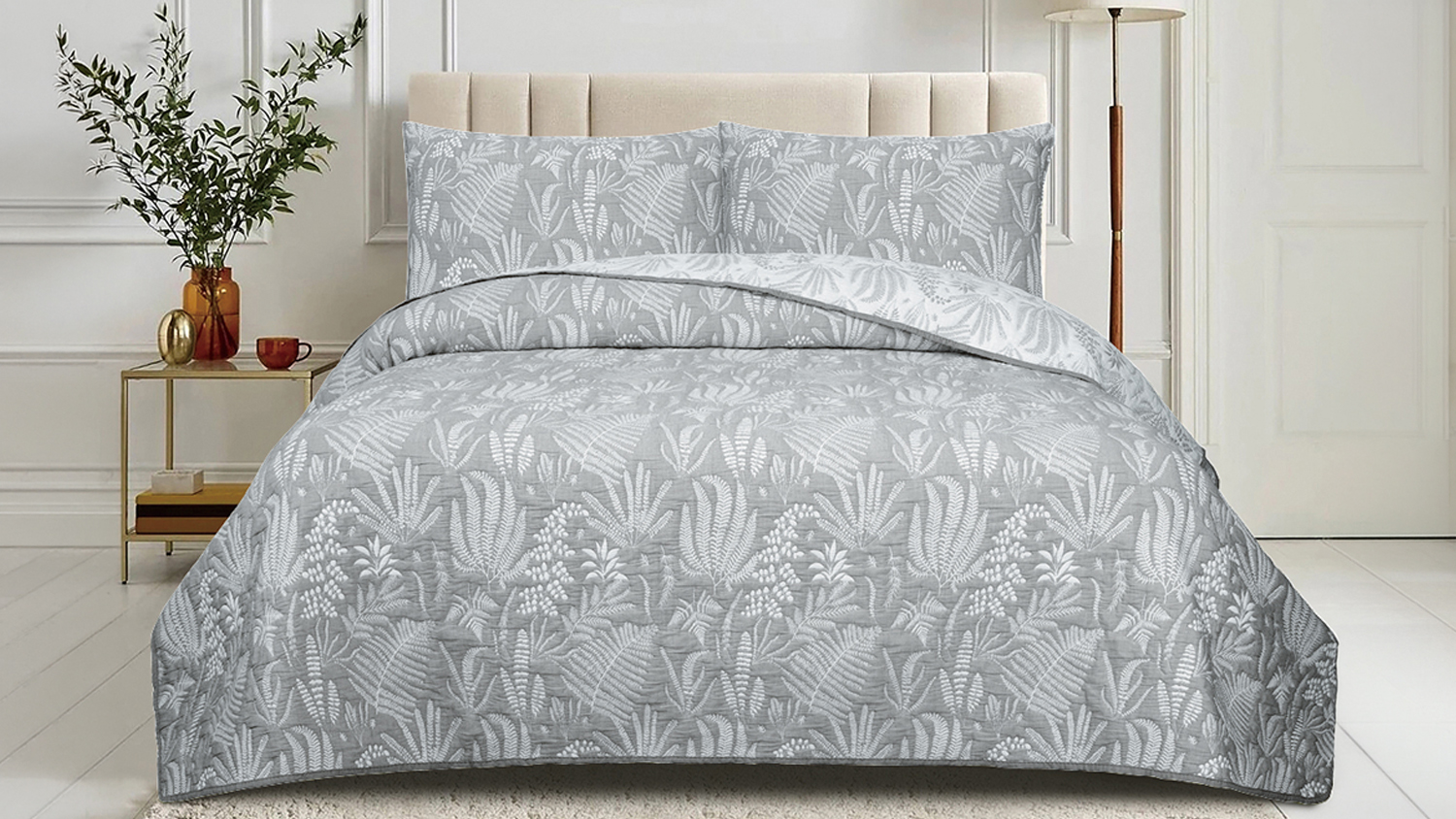 Wide bedroom scene showing the Botanical Bay Silver Coverlet Set on a neatly made bed