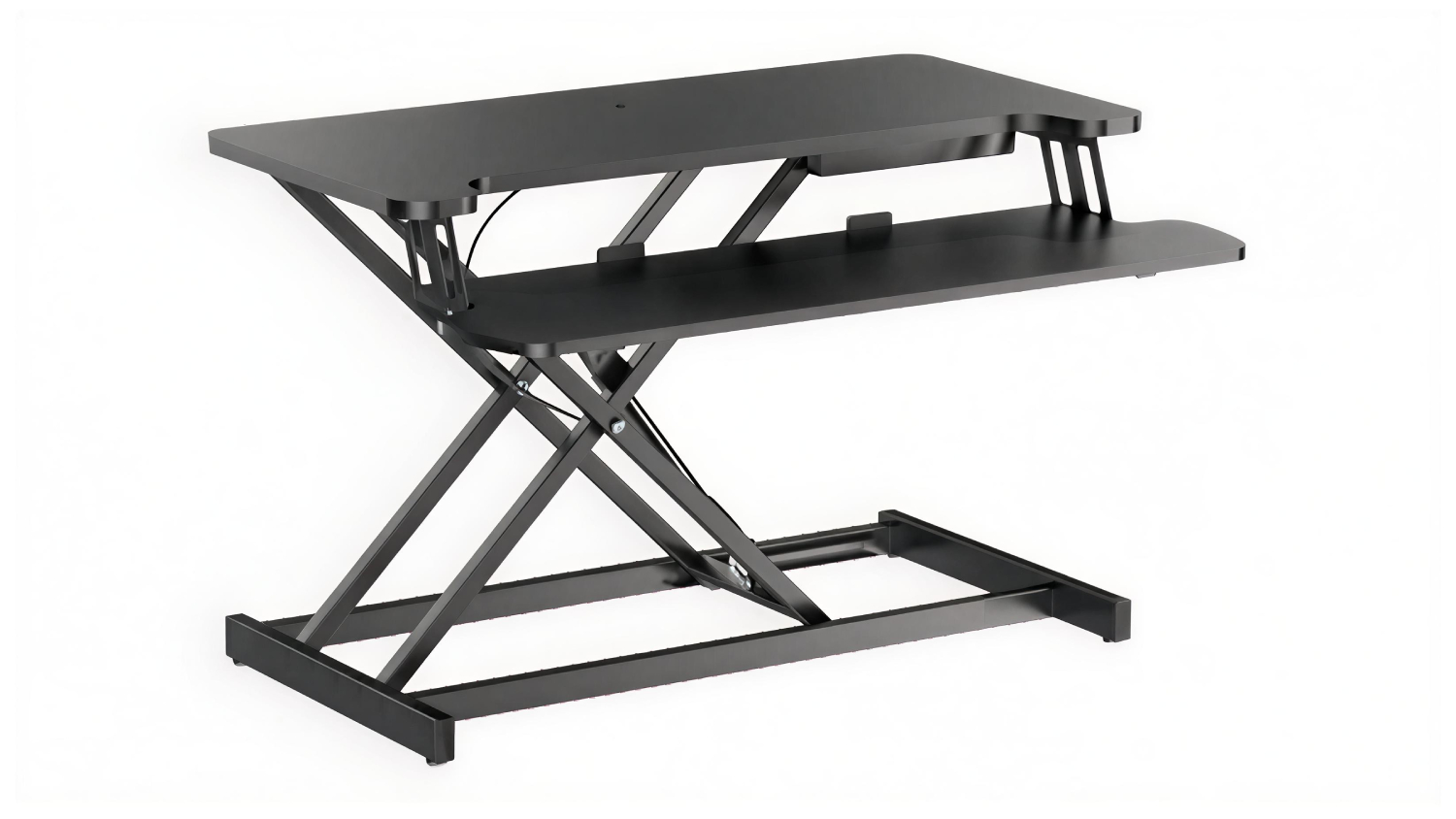 Adjustable black Konic Gaslift standing desk converter with an X-shaped lift frame and a two-tier work surface, shown partially raised