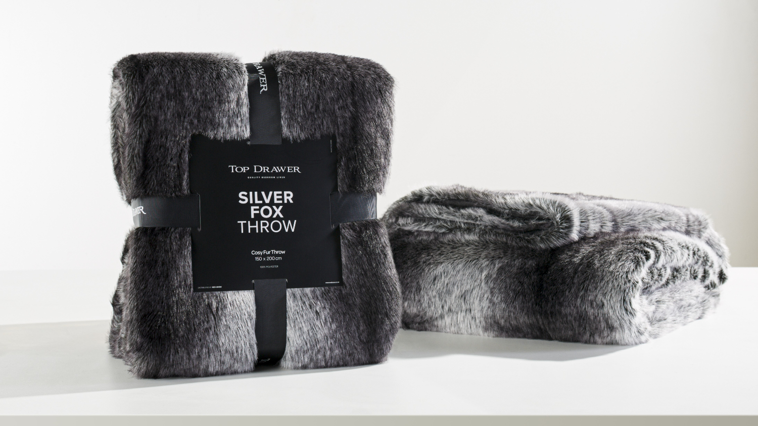 A Silver Fox Black/Silver Faux Fur Throw by Top Drawer