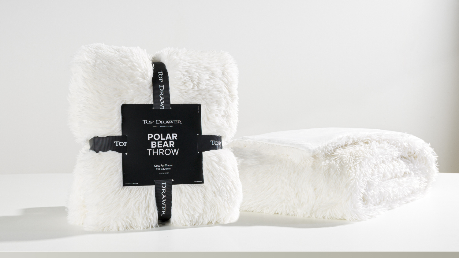 A Polar Bear White Faux Fur Throw by Top Drawer