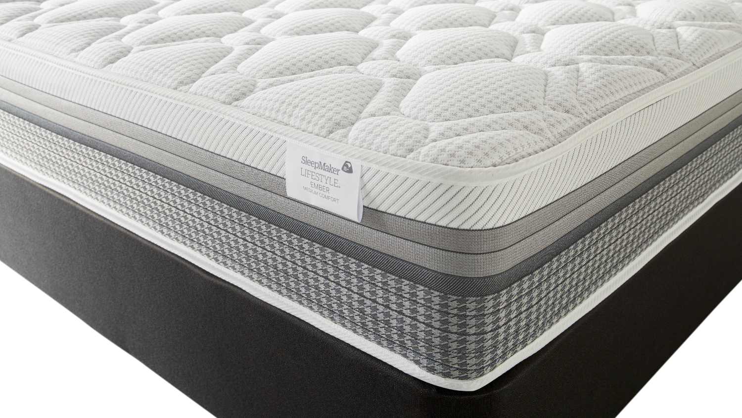 Corner view of the mattress with a quilted top