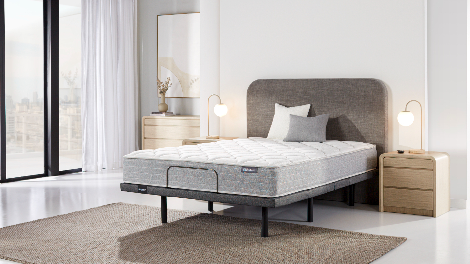 Front angled view of the Sealy queen mattress lying flat on the adjustable base