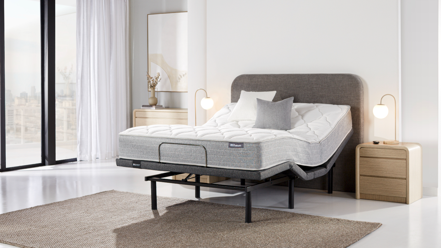 Side view of the adjustable base in use, with the head and foot sections raised independently