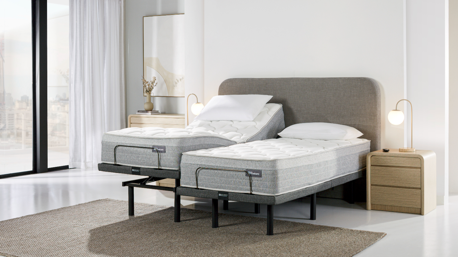 Side angled view showing the split adjustable base in use. One mattress section is elevated at the head