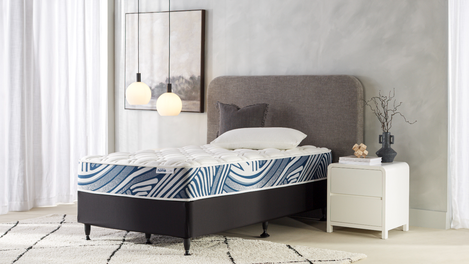 Dream Medium King Single Mattress with Connect Base by SleepMaker, shown fully styled in a modern bedroom
