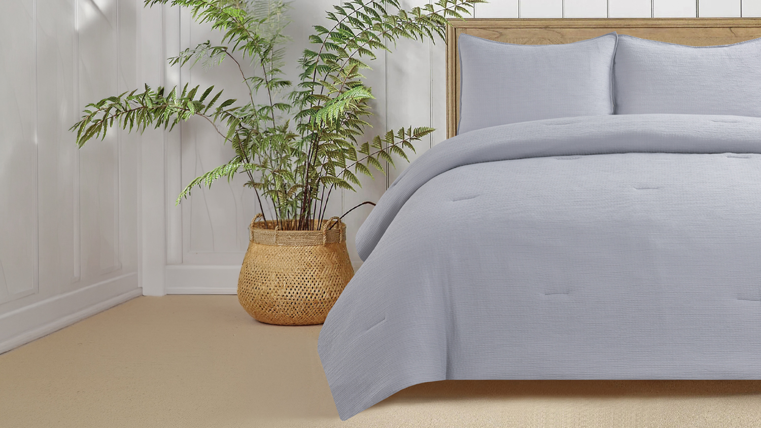 Stone-coloured Malmo comforter set styled on a bed with two matching pillows