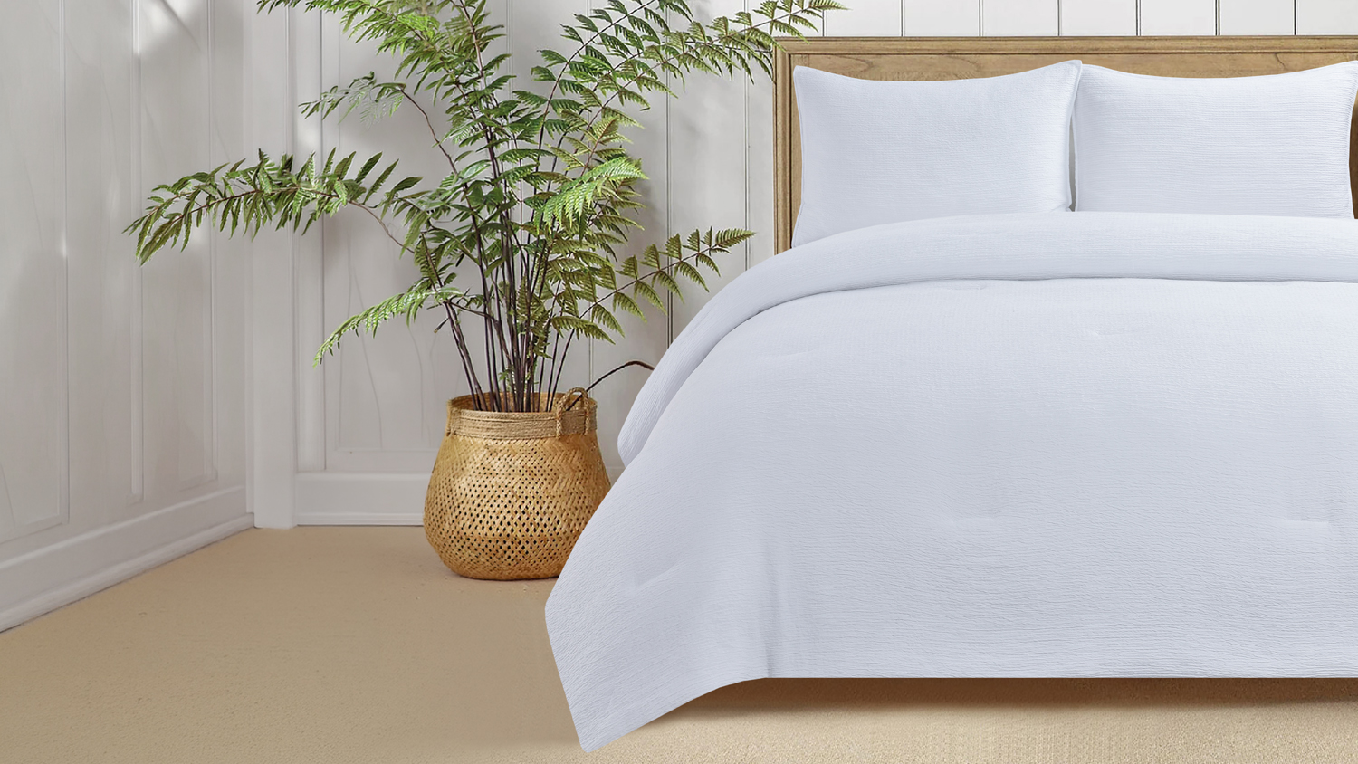 White Malmo comforter set styled on a bed with two matching pillows