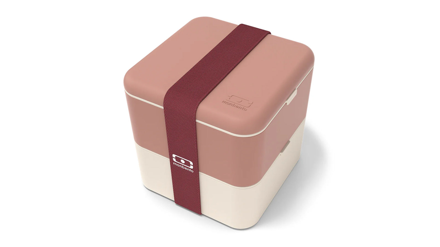 A square, two-tier Monbento MB Square stacking bento box in pink and cream, featuring rounded corners and a burgundy elastic band at the centre