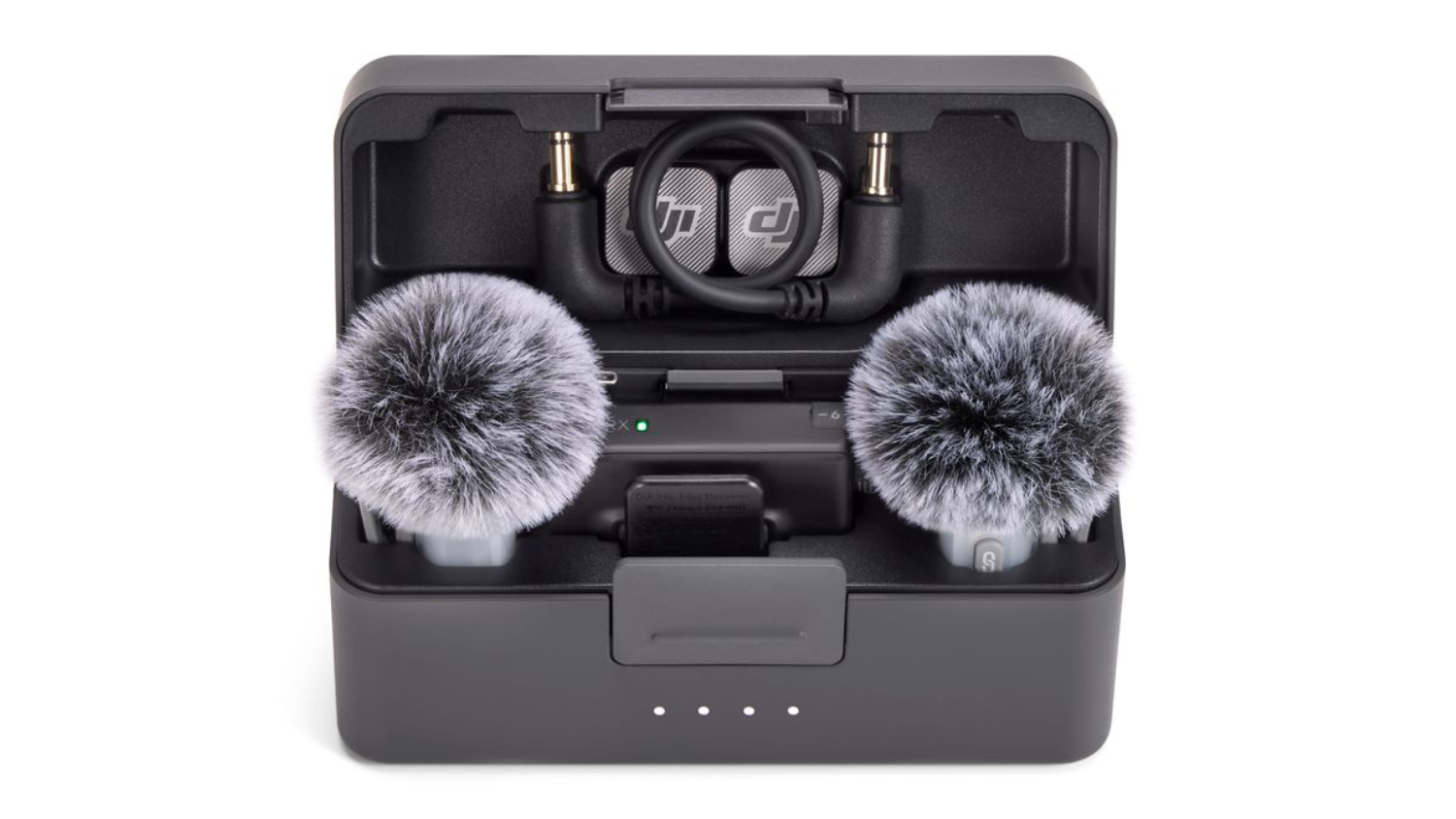 An open DJI Mic Mini 2 charging case with two furry windshields and the receiver inside