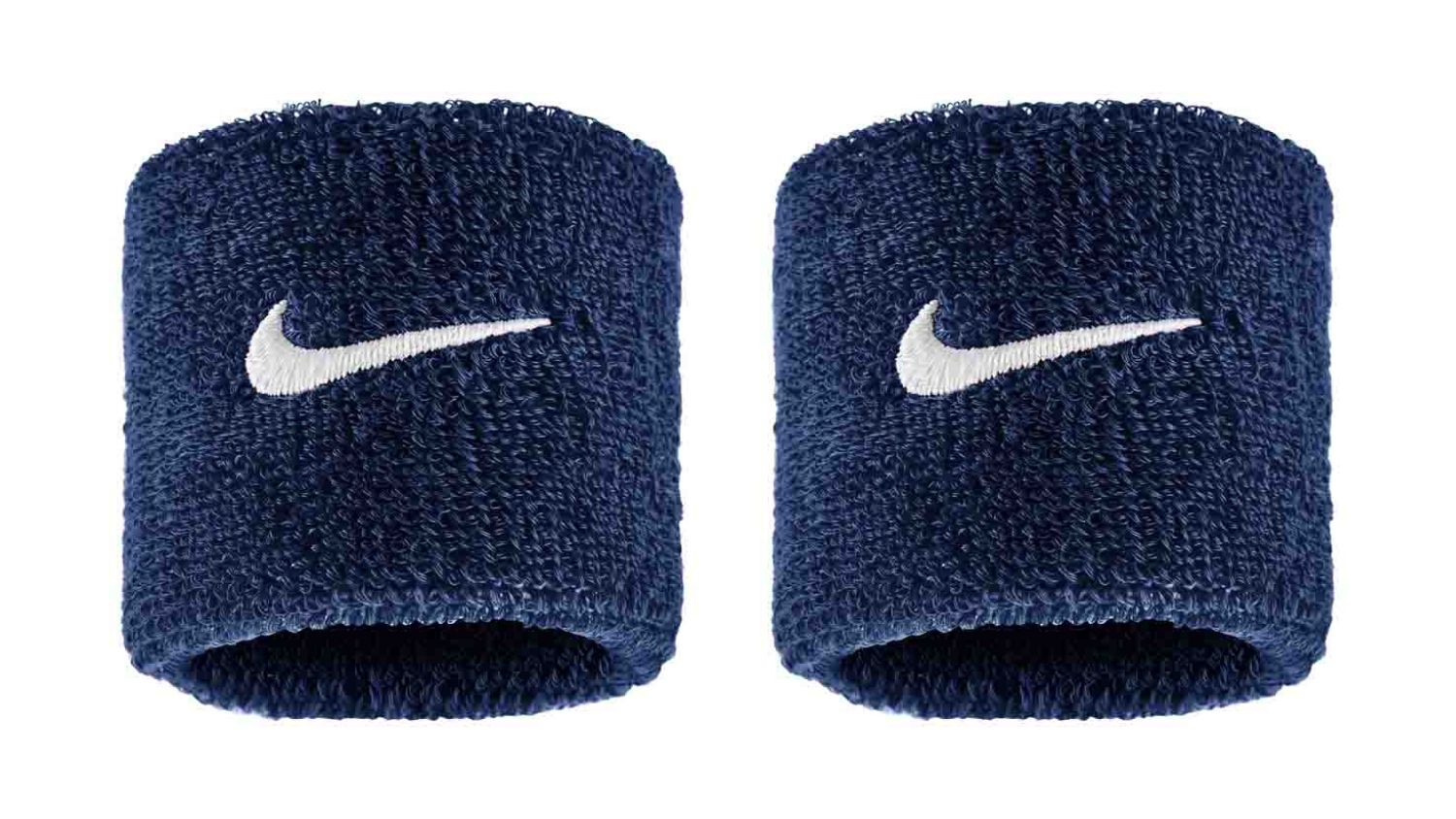 Pair of navy blue Nike wristbands with white Swoosh logo