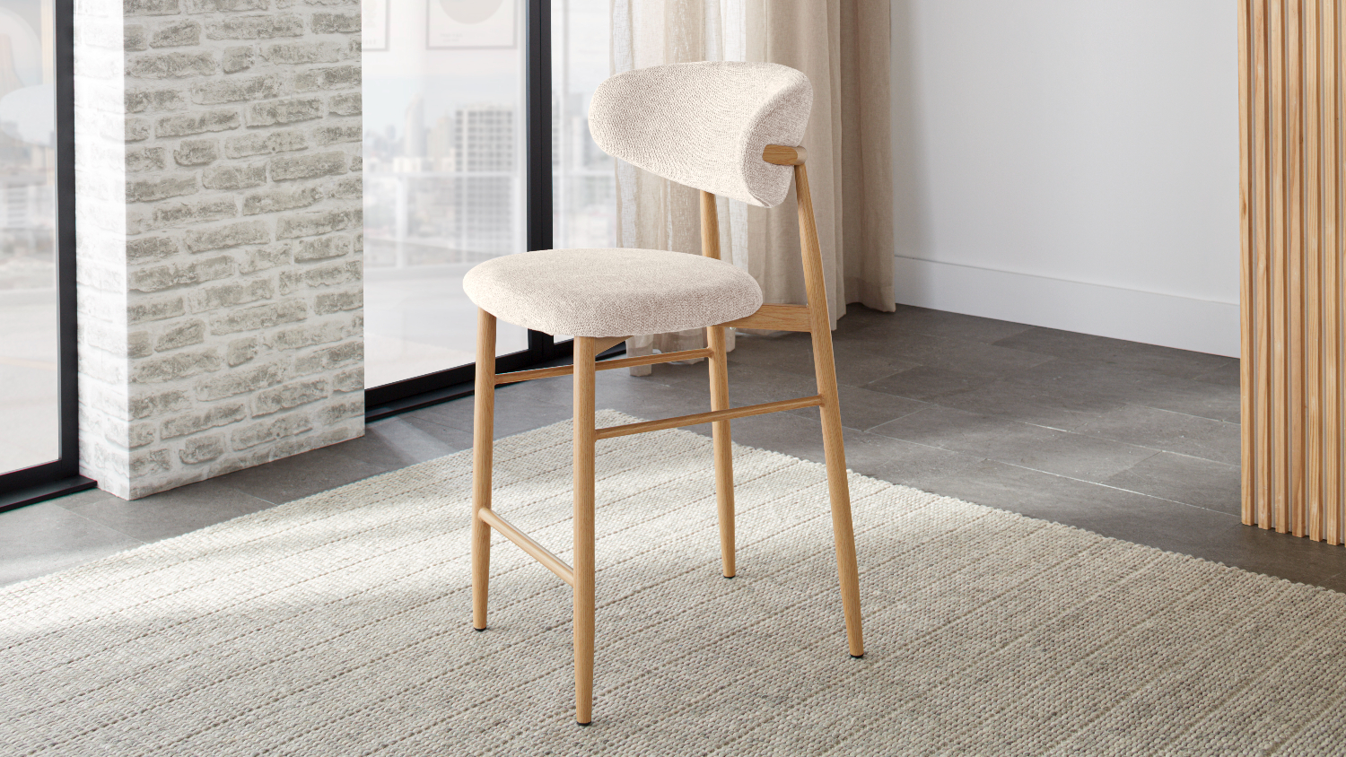 Full view of the bar chair upholstered in beige fabric