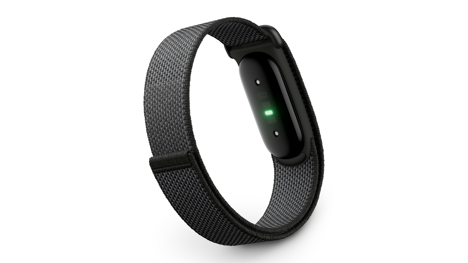 A close-up of a black Fitbit Air fitness tracker with a woven band, showing the heart rate sensor glowing green on the underside