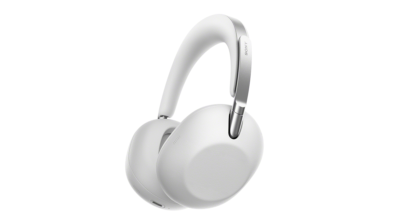 Angled side view of the Sony WH‑1000X platinum silver over‑ear headphones showing plush earcup and Sony logo