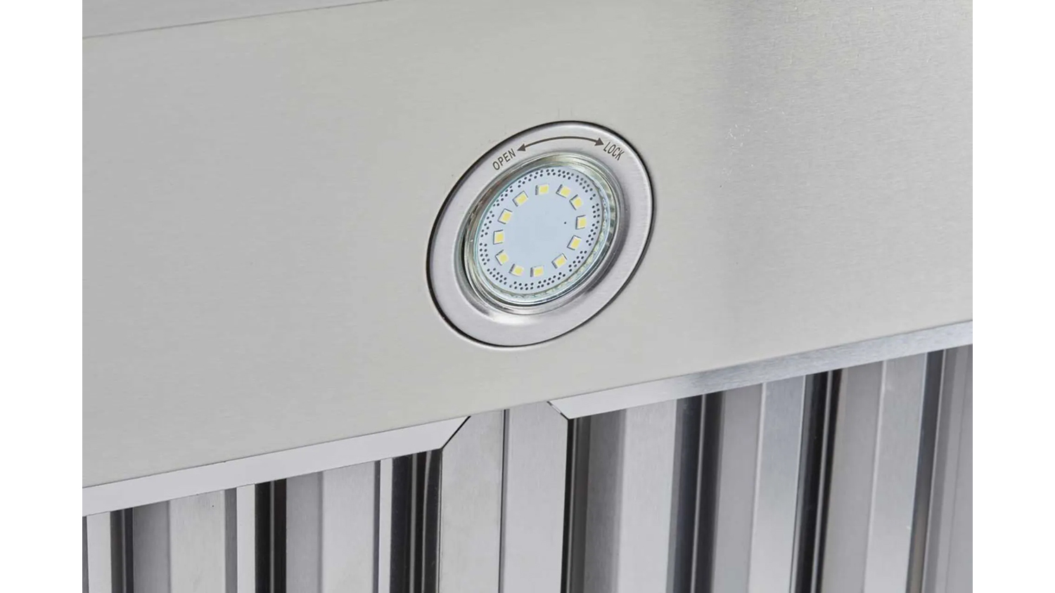 Recessed LED cabinet light with twist-lock design installed in a modern kitchen panel