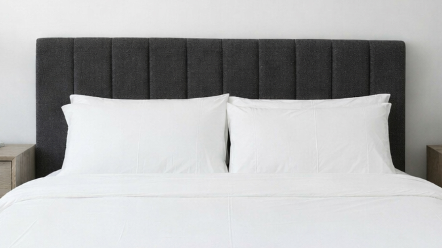 Nile King Single upholstered headboard fabric with vertical panels, paired with white pillows in a bedroom setting