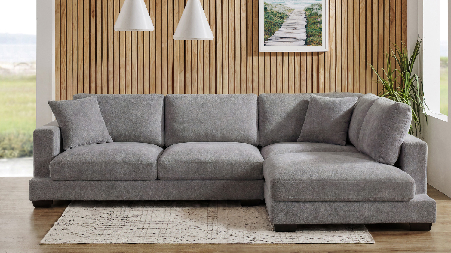 Storm fabric corner sofa with a left-hand chaise, three seat cushions, and plush backrests