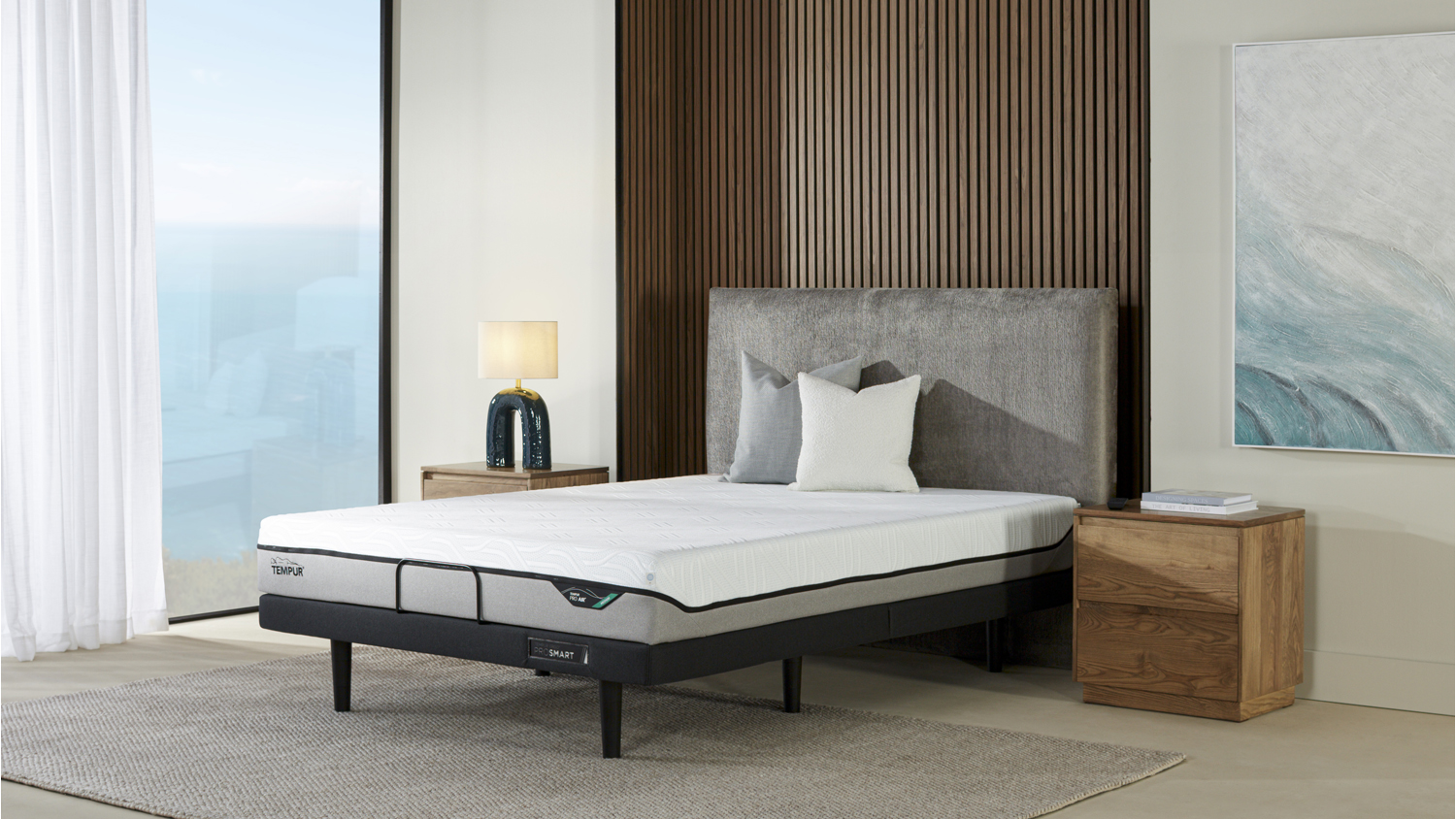 Pro Air Soft Extra Long Single Mattress on a modern bedframe with a grey fabric headboard and wooden nightstands