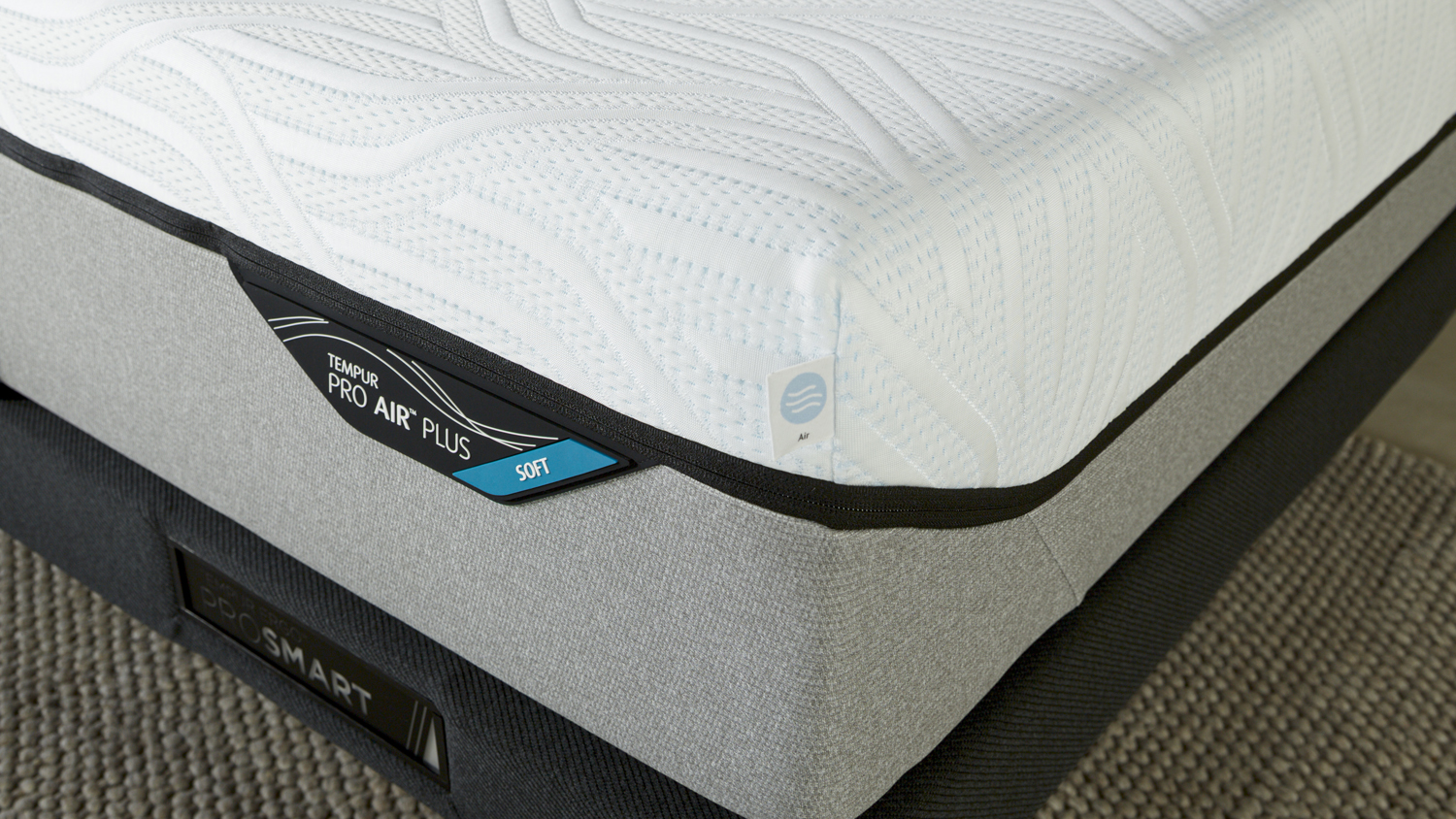 A close-up corner shot highlighting the "Soft" firmness label on a Tempur Pro Air Plus mattress