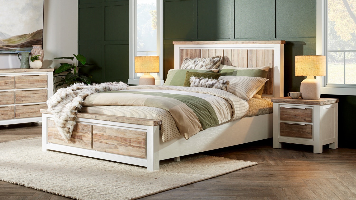 A modern rustic Homestead king bed frame with white trim and light wood panels, styled with neutral and green bedding