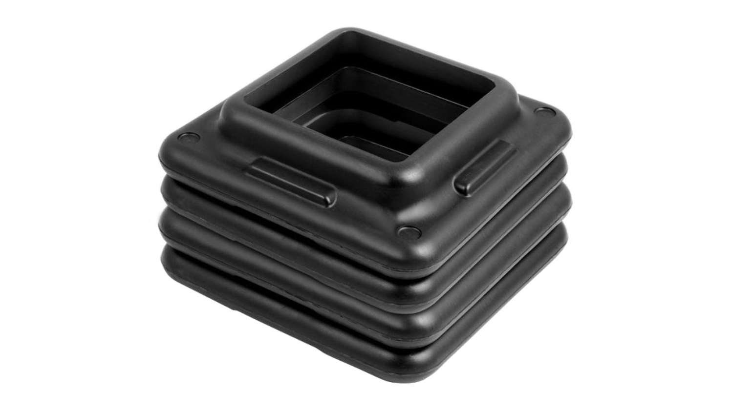 A stack of four square black plastic risers for an Everfit aerobic exercise step platform