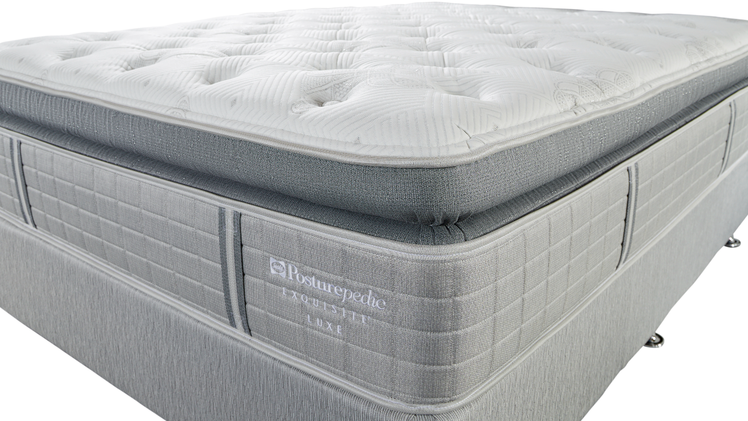 Close-up, high-angle view of the plush, quilted surface of a Sealy Posturepedic Super King Soft mattress